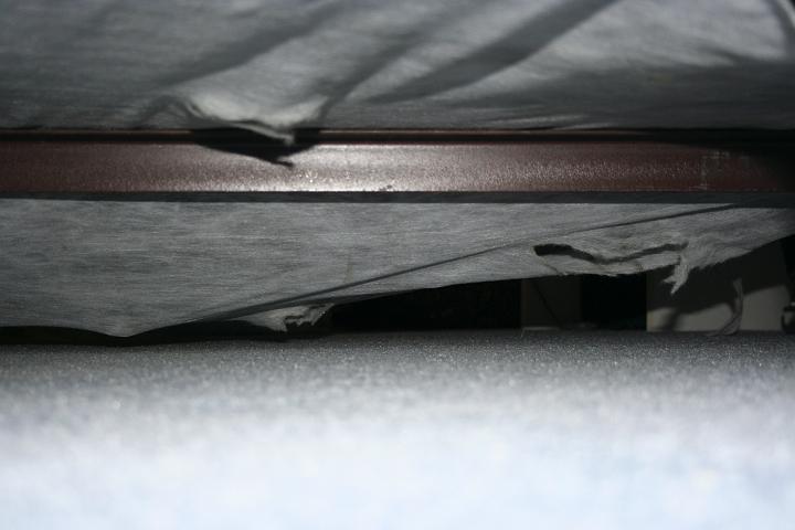 IMG_0982.jpg - I was staying at my parents house while they were on a trip for a week... maxie wasn't comfortable walkin around the huge house... I came home and I couldn't find her... I was FREAKIN out! I searched all of her usual hiding spots... behind the tv... behind the couch... under the bed... for about 20 min... the I took a closer look under the bed... it was sagging underneath... she went IN the boxspring!! through the hole in the fabric...