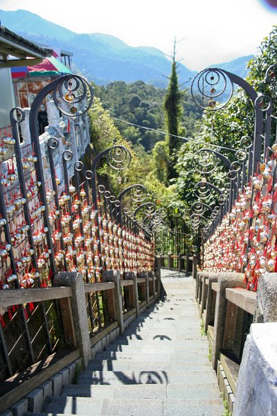 outside the temple they had a walkway full of bells.
